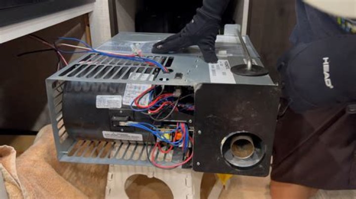 How do I reset my Dometic camper refrigerator?