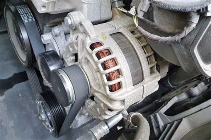 How do you remove an alternator from a car?